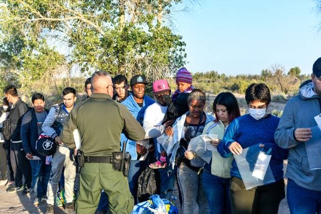 YUMA, AZ - MAY 11: Migrants seen set to cross the border at Cocopah Indian Reservation before Title 42 is set to end at 11:59pm allowing all migrants to apply for asylum after the three-year COVID-era health ban. Yuma, Arizona on May 11, 2023. Copyright: xDeeCeexCarterx
