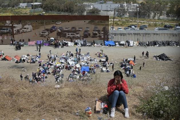 Migrants have been stuck between the primary and secondary fencing at the Tijuana-San Diego border for over a week, as many of the migrants are waiting and hoping to be allowed to immigrate to the U.S. more easily after the Title-42 deportation order expires on May 11, as seen from Tijuana, Mexico on Thursday, May 11, 2023.  TIJ2023051101 CarlosxMoreno