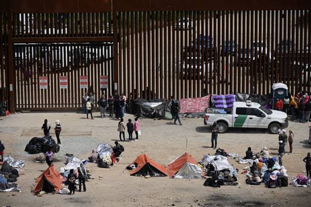 Migrants stuck between the primary and secondary fencing at the Tijuana-San Diego border for over a week, wait and hope to be allowed to immigrate to the U.S. more easily after the Title-42 deportation order expires on May 11, as seen from Tijuana, Mexico on Thursday, May 11, 2023.  TIJ2023051109 CarlosxMoreno UPI