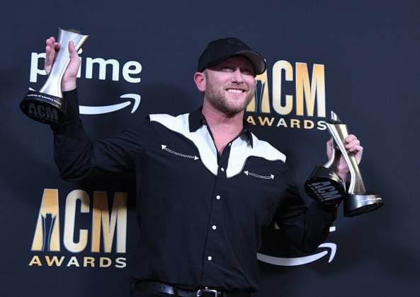 Cole Swindell shows off his AMC Awards for Single and Song of the Year at the 2023 Academy of Country Music Awards at The Star in Frisco, TX on Thursday, May 11, 2023.  FRS2023051143 IANxHALPERIN