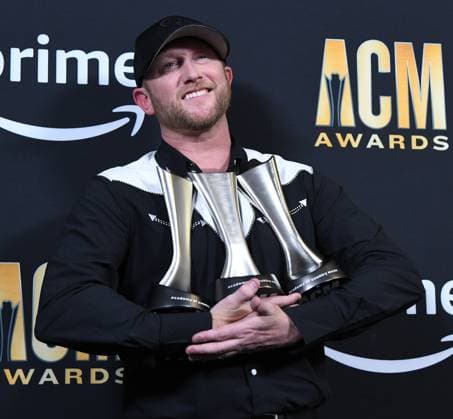 Cole Swindell shows off his AMC Awards for Single and Song of the Year at the 2023 Academy of Country Music Awards at The Star in Frisco, TX on Thursday, May 11, 2023.  FRS2023051144 IANxHALPERIN