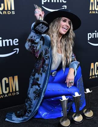 Lainey Wilson shows off her four awards, Female Artist of the Year, Album of the Year for Bell Bottom Country plus Visual Media of the Year and Music Event of the Year at the Academy of Country Music Awards at The Star in Frisco, TX on Thursday, May 11, 2023.  FRS2023051150 IANxHALPERIN