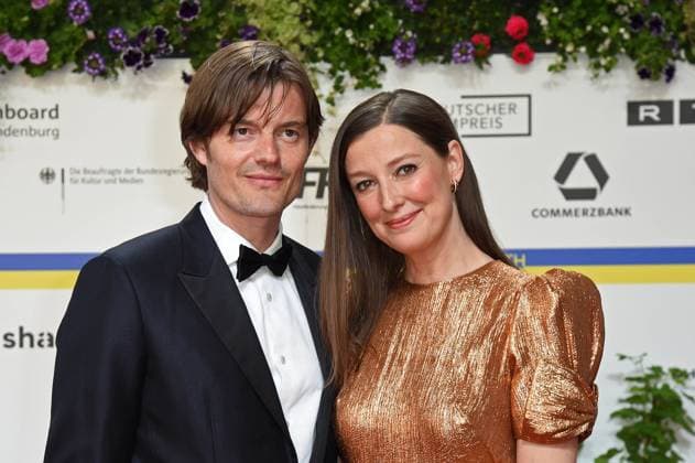 Alexandra Maria Lara with husband Sam Riley arriving on the red carpet for the GERMAN FILM AWARD 2023 at the Theater am Potsdamer Platz in Berlin on 12 05 2023