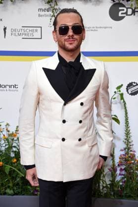 Riccardo Simonetti arriving on the red carpet for the GERMAN FILM AWARD 2023 at the Theater am Potsdamer Platz in Berlin on 12 05 2023