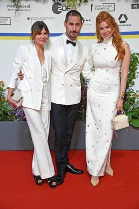 Jeanne Tremsal, Clemens Schick, Palina Rojinski arriving on the red carpet for the GERMAN FILM AWARD 2023 at the Theater am Potsdamer Platz in Berlin on 12 05 2023