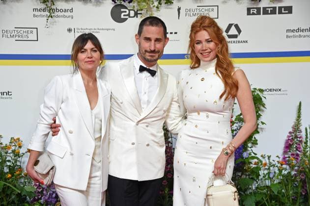 Jeanne Tremsal, Clemens Schick, Palina Rojinski arriving on the red carpet for the GERMAN FILM AWARD 2023 at the Theater am Potsdamer Platz in Berlin on 12 05 2023