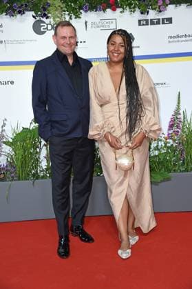 Devid Striesow with girlfriend Ines Ganzberger arriving on the red carpet for the GERMAN FILM AWARD 2023 at the Theater am Potsdamer Platz in Berlin on 12 05 2023