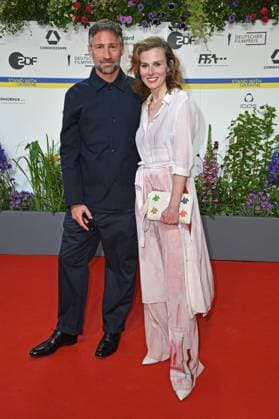 Benjamin Sadler, Karin Hanczewski arriving on the red carpet for the GERMAN FILM AWARD 2023 at the Theater am Potsdamer Platz in Berlin on 12 05 2023