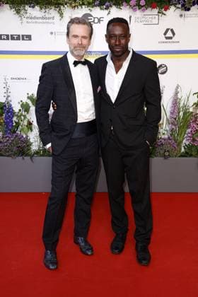Matthias Matschke and Jerry Kwarteng at the arrival to the German Film Award ceremony on 12 05 2023 in Berlin German Film Award 2023 in Berlin Arrival Red Carpet