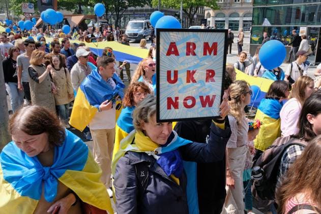 Solidarity Demonstration Ukraine Aachen, 14 05 2023 Demonstration and rally for Charlemagne Prize 2023 to Volodymyr Selenskyj and the Ukrainian people AachenStandsWithUkraine Participant with poster for arms deliveries to Ukraine Aachen city center NRW Germany