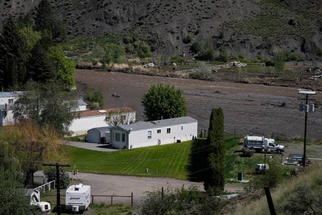 May 14, 2023, CACHE CREEK, BC, CANADA: The swollen Bonaparte River flows past an evacuated mobile home community in Cache Creek, B.C., on Sunday, May 14, 2023. Environment Canada says unseasonably hot temperatures in British Columbia will persist over the coming days, with special weather statements warning of high river streamflows due to melting snow in hard-hit communities in the province s interior. CACHE CREEK CANADA  - ZUMAc35_ 20230514_zaf_c35_120 Copyright: xDarrylxDyckx