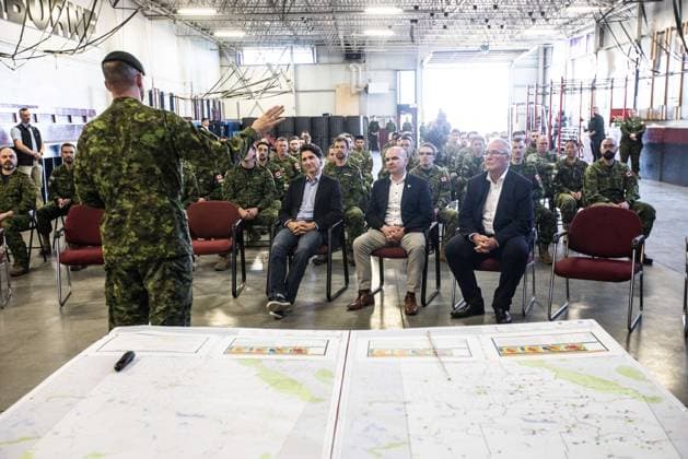 May 15, 2023, EDMONTON, AB, CANADA: Prime Minister Justin Trudeau, MP Randy Boissonnault, centre and MP Bill Blair meet with members of the Canadian Armed Forces who are assisting in the Alberta wildfires, in Edmonton on Monday May 15, 2023. EDMONTON CANADA  - ZUMAc35_ 20230515_zaf_c35_026 Copyright: xJasonxFransonx