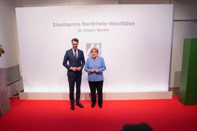 Award NRW State Prize to Angela Merkel Minister President of the State of North Rhine Westphalia Hendrik Wuest together with Chancellor a D Dr Angela Merkel on the Red Carpet for the award of the State Prize 2023 of the State of North Rhine Westphalia to the Chancellor a D in the Flora in Cologne,16 05 2023, Cologne, Cologne North Rhine Westphalia Germany