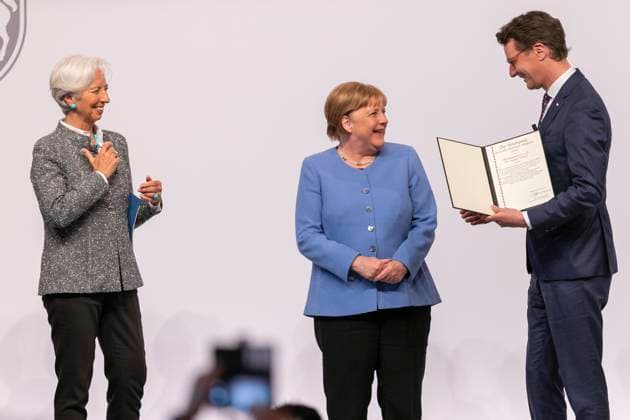 vl Christine Lagarde President of the European Central Bank , Dr Angela Merkel Chancellor a D , Hendrik Wuest State Premier North Rhine Westphalia , Cologne, Award of the State Prize of the State of North Rhine Westphalia to Chancellor a D Dr Angela Merkel, 16 05 2023, Flora Cologne