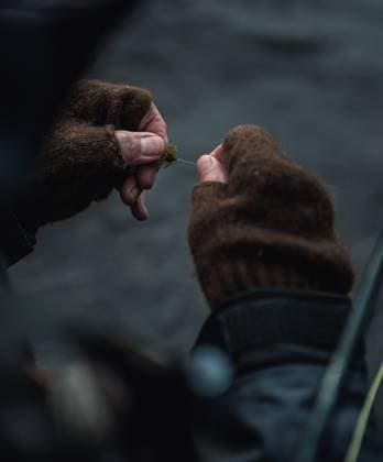 Close up detail photo of man tying fly onto fly line Pittsburg, New Hampshire, United States CR_BRDO230211C-1125388-01