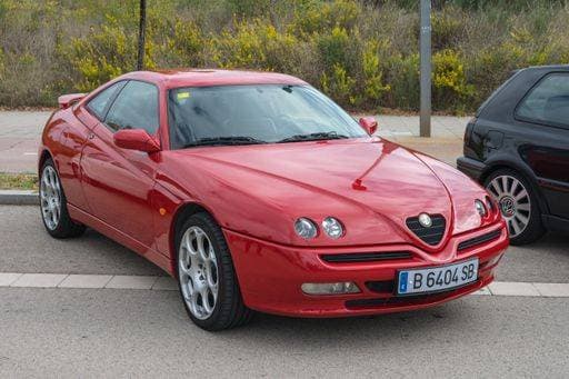 RECORD DATE NOT STATED Front view of the classic Italian sports car Alfa Romeo GTV in red color *** vorne Ansicht des der klassisch italienisch Sportarten Auto Alfa ROMEO&JULIA GTV ÊIn Roter farbiges 19477055