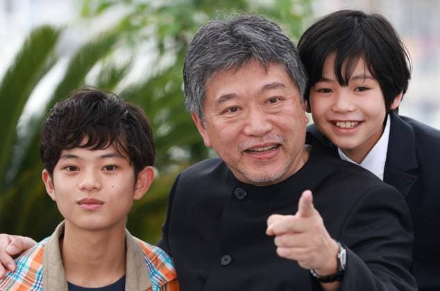 (230518) -- CANNES, May 18, 2023 -- Japanese director Kore-Eda Hirokazu (C) poses with cast members during a photocall for the film Kaibutsu (Monster) which will compete for the Palme d Or during the 76th edition of the Cannes Film Festival in Cannes, southern France, May 18, 2023. ) FRANCE-CANNES-FILM FESTIVAL-KAIBUTSU GaoxJing 