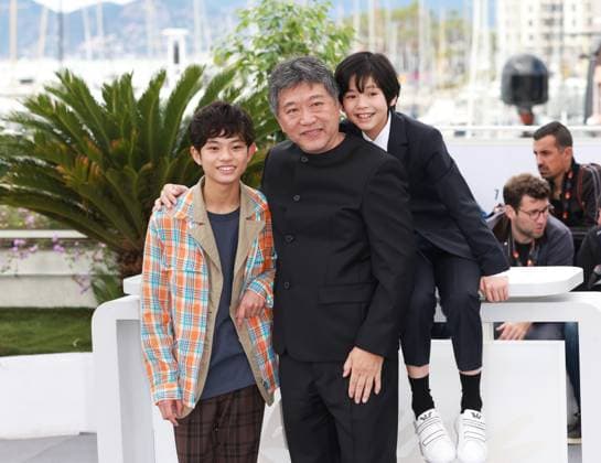 (230518) -- CANNES, May 18, 2023 -- Japanese director Kore-Eda Hirokazu (C) poses with cast members during a photocall for the film Kaibutsu (Monster) which will compete for the Palme d Or during the 76th edition of the Cannes Film Festival in Cannes, southern France, May 18, 2023. ) FRANCE-CANNES-FILM FESTIVAL-KAIBUTSU GaoxJing 