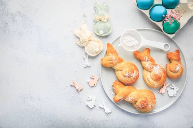 Easter baking - Buns made from yeast dough in a shape of Easter bunny and colored eggs Easter baking - Buns made from yeast dough in a shape of Easter bunny and colored eggs Copyright: xZoonar.com IngridxBalabanovax 19962425