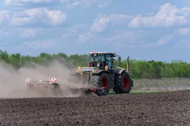Farm Pershe Travnia of Kherson region rebuilding after liberation from Russian invasion Recently de-mined field is plowed for planting at farm Pershe Travnia of village Velyka Oleksandrivka of Kherson region seen after liberation from Russian invasion. The farm was producing grain (wheat, barley, sunflower), meat (pork), and other products; with 100 employees and more than 3,000 hectares of fields, more than 1200 pigs. The farm was completely destroyed, all equipment, harvest from 2021, fertilizer, all buildings including storages for grain and places where pigs were kept and fed. After bombing pigs were either burned alive, some in panic jumped into the well. Serhiy Kosyuk estimates that the cost of rebuilding from scratch will be at least Copyright: LevxRadin