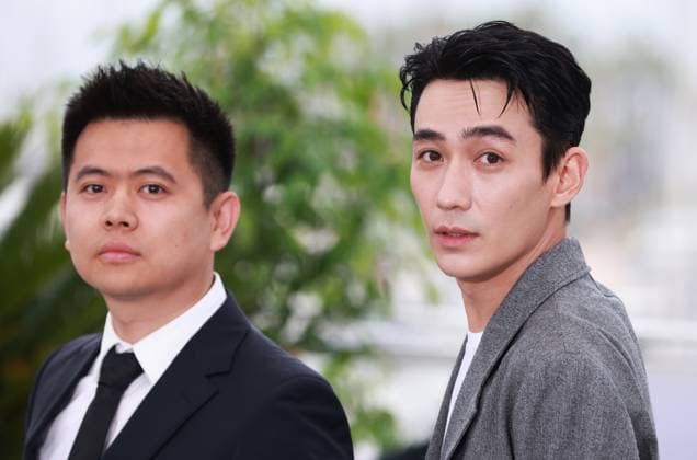 (230520) -- CANNES, May 20, 2023 -- Chinese director Wei Shujun (L) and actor Zhu Yilong pose during a photocall for the film He Bian De Cuo Wu (Only the River Flows) in competition for the category Un Certain Regard at the 76th edition of the Cannes Film Festival in Cannes, southern France, on May 20, 2023. ) FRANCE-CANNES-FILM FESTIVAL-ONLY THE RIVER FLOWS-PHOTOCALL GaoxJing 