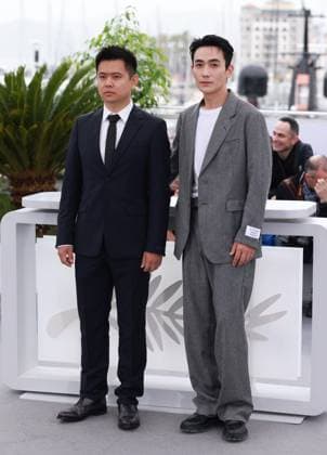 (230520) -- CANNES, May 20, 2023 -- Chinese director Wei Shujun (L) and actor Zhu Yilong pose during a photocall for the film He Bian De Cuo Wu (Only the River Flows) in competition for the category Un Certain Regard at the 76th edition of the Cannes Film Festival in Cannes, southern France, on May 20, 2023. ) FRANCE-CANNES-FILM FESTIVAL-ONLY THE RIVER FLOWS-PHOTOCALL GaoxJing 
