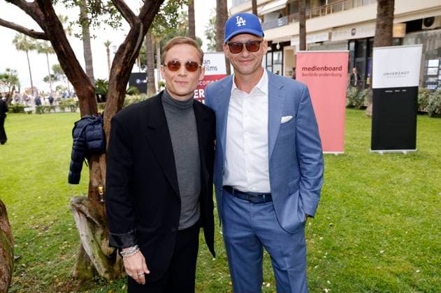 Matthias Schweighöfer and Frank Kusche at the German Films and Medienboard reception 2023 in the garden of the Hotel Mondrian Cannes at the Festival de Cannes 2023 76 Cannes International Film Festival at the Palais des Festivals Cannes, 20 05 2023 Foto:xS.xGabschx xFuturexImage