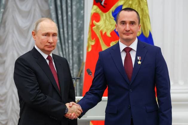 RUSSIA, MOSCOW - MAY 23, 2023: Russia s President Vladimir Putin awards the Hero of Russia and Honorary Space Pilot titles to Roscosmos Cosmonaut Corps member Pyotr Dubrov during a ceremony to present state decorations at the Moscow Kremlin. Vyacheslav Prokofyev TASS  59317452