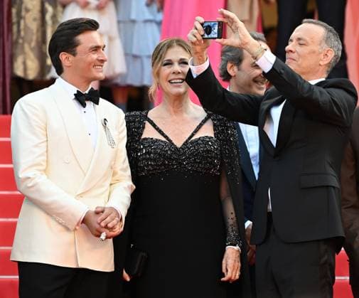 British actor Rupert Friend, American actress Rita Wilson and actor Tom Hanks attend the premiere of Asteroid City at the 76th Cannes Film Festival at Palais des Festivals in Cannes, France on Tuesday, May 23, 2023.  CAN20230523196 RUNExHELLESTAD