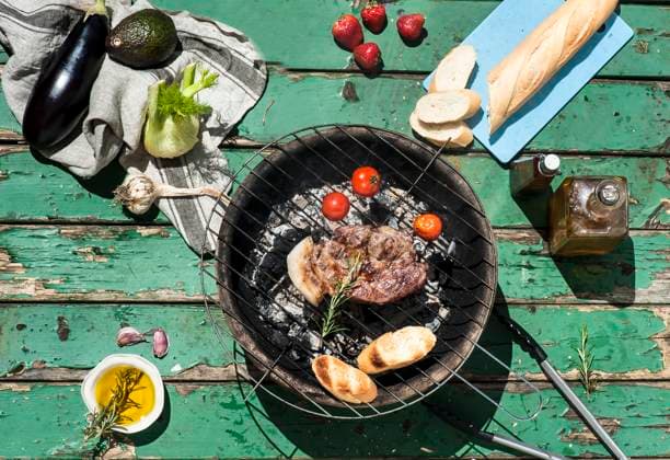 Meat, tomatoes and baguette slices cooking on barbecue grill property released, HHF05876