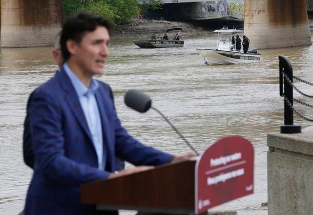 May 24, 2023, WINNIPEG, MANITOBA, CANADA: Police boats look on as Prime Minister Justin Trudeau announces a water research project at The Forks in Winnipeg, Wednesday, May 24, 2023. WINNIPEG CANADA  - ZUMAc35_ 20230524_zaf_c35_089 Copyright: xJohnxWoodsx