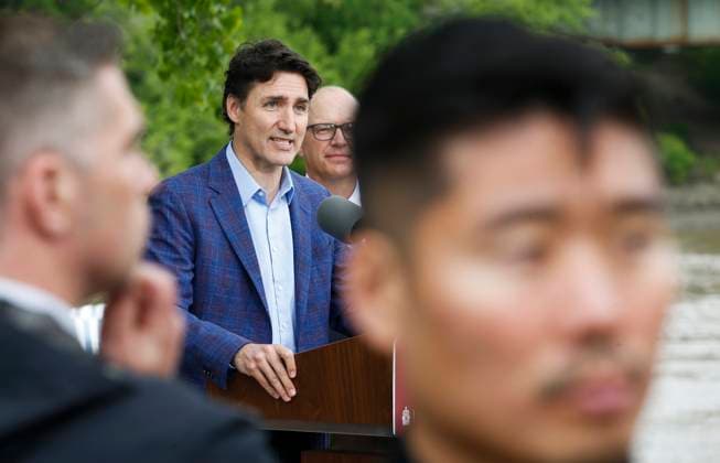 May 24, 2023, WINNIPEG, MANITOBA, CANADA: Security scans the crowd as Prime Minister Justin Trudeau announces a water research project at The Forks in Winnipeg, Wednesday, May 24, 2023. WINNIPEG CANADA  - ZUMAc35_ 20230524_zaf_c35_091 Copyright: xJohnxWoodsx