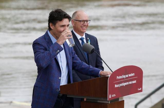 May 24, 2023, WINNIPEG, MANITOBA, CANADA: Prime Minister Justin Trudeau takes a drink or water as Winnipeg Mayor Scott Gillingham looks on after announcing a water research project at The Forks in Winnipeg, Wednesday, May 24, 2023. WINNIPEG CANADA  - ZUMAc35_ 20230524_zaf_c35_092 Copyright: xJohnxWoodsx