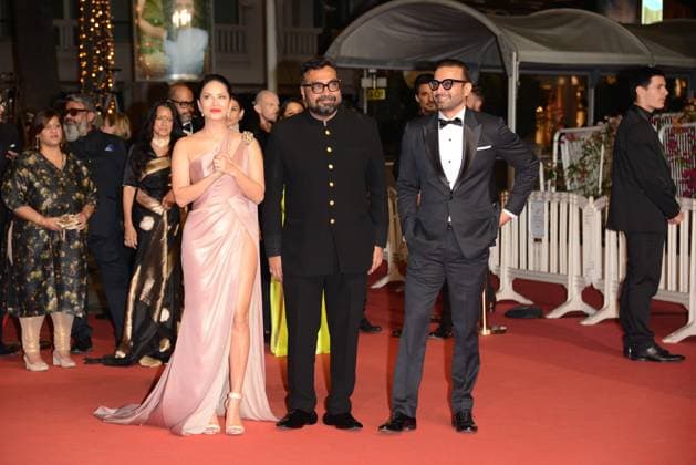 May 25, 2023, CANNES, France: CANNES, FRANCE - MAY 24: (L-R) Sunny Leone, Director Anurag Kashyap and Rahul Bhat attend the Kennedy red carpet during the 76th annual Cannes film festival at Palais des Festivals on May 24, 2023 in Cannes, France CANNES France - ZUMAi09_ 20230525_zaf_i09_023 Copyright: xFrederickxInjimbertx