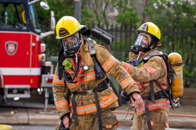 May 26, 2023, MONTREAL, PQ, CANADA: A firefighter is brushed down at the scene of a five-alarm fire at the former Monastere du Bon Pasteur, a 19th century heritage building on Friday May 26, 2023 in Montreal. MONTREAL CANADA  - ZUMAc35_ 20230526_zaf_c35_008 Copyright: xChristinnexMuschix