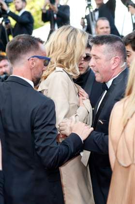 Alina Baikova is led off the carpet by security at the premiere of the feature film The Old Oak at the Festival de Cannes 2023 76 Cannes International Film Festival at the Palais des Festivals Cannes, 26 05 2023 Foto:xD.xBedrosianx xFuturexImage