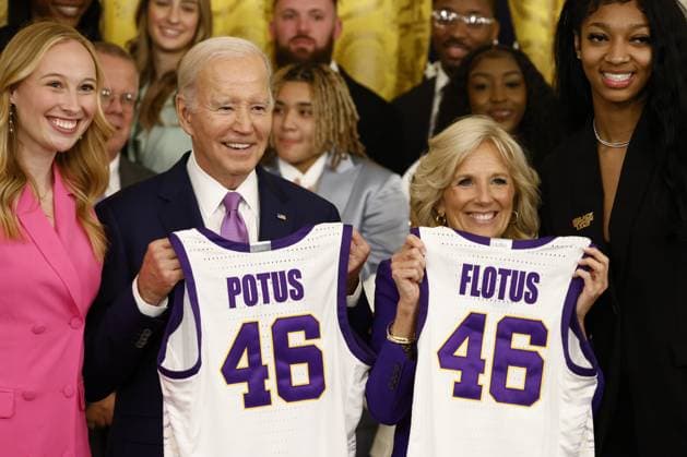 President Joe Biden and first lady Jill Biden display their jerseys during an event with the Louisiana State University (LSU) women s basketball team in the East Room at the White House in Washington, DC on Friday, May 26, 2023. The event is celebrating the LSU Tigers winning the 2022-2023 NCAA championship. Tigers Angel Reese is at right and Emily Ward at left.  WASP20230526101 SamuelxCorum