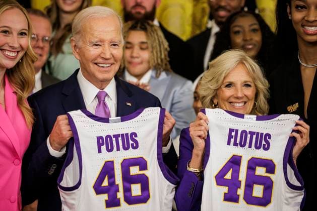 Team Captains Angel Reese (right) and Emily Ward (left) present President Joe Biden and First Lady Jill Biden with their own jerseys during an event with the Louisiana State University (LSU) women s basketball team in the East Room at the White House in Washington, DC on Friday, May 26, 2023. The event is celebrating the LSU Tigers winning the 2022-2023 NCAA championship.  WASP20230526105 SamuelxCorum
