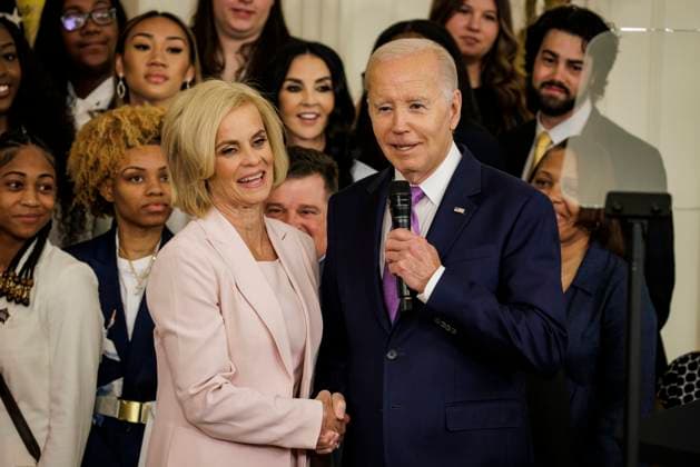 President Joe Biden congratulates Head Coach Kim Mulkey during an event with the Louisiana State University Women s Basketball team in the East Room at the White House on May 26, 2023 in Washington, D.C. The event is celebrating the Louisiana State University Tigers Women s Basketball team winning the 2022-2023 NCAA championship.  WASP20230526110 SamuelxCorum
