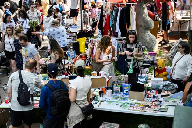 May 27, 2023, Ottawa, ON, CAN: Bargain hunters check out tables of goods set up at the Great Glebe Garage Sale, in Ottawa, on Saturday, May 27, 2023. The community event draws thousands of people to the Glebe, one of OttawaöÄÃ s heritage neighbourhoods, with vendors donating a percentage proceeds to the Ottawa Food Bank. Ottawa CAN - ZUMAc35_ 20230527_zaf_c35_013 Copyright: xJustinxTangx