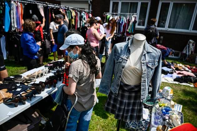 May 27, 2023, Ottawa, ON, CAN: A mannequin is dressed as bargain hunters check out clothing racks set up at the Great Glebe Garage Sale, in Ottawa, on Saturday, May 27, 2023. The community event draws thousands of people to the Glebe, one of OttawaöÄÃ s heritage neighbourhoods, with vendors donating a percentage proceeds to the Ottawa Food Bank. Ottawa CAN - ZUMAc35_ 20230527_zaf_c35_019 Copyright: xJustinxTangx