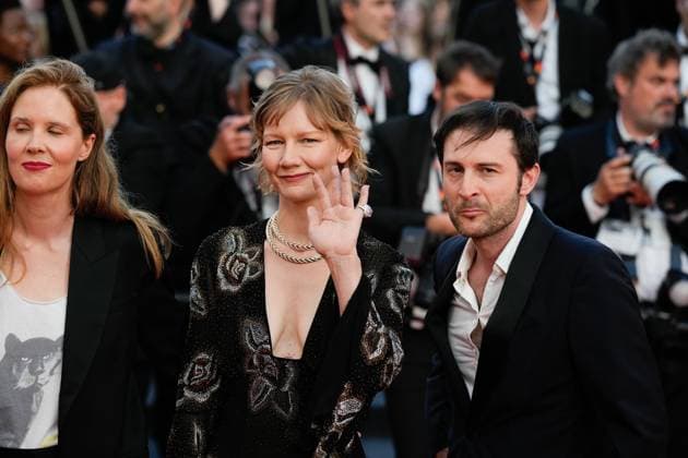 The Elemental Red Carpet Premiere at the 76th Edition of the Cannes Film Festival Director Justine Triet, winner of The Palme D Or Award for Anatomy of a Fall ( Anatomie d une chute ), alongside Arthur Harari and Sandra Huller, attend the movie screening and red carpet event for Elemental , directed by Peter Sohn, during the 76th edition of the Cannes Film Festival on May 27 2023, in Cannes, France Cannes Palace of Festivals and Congresses of Cannes Cannes France Copyright: xAlexandraxFechetex _ADR9718