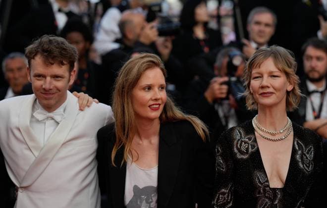 The Elemental Red Carpet Premiere at the 76th Edition of the Cannes Film Festival Director Justine Triet, winner of The Palme D Or Award for Anatomy of a Fall ( Anatomie d une chute ), alongside Antoine Reinartz and Sandra Huller, attend the movie screening and red carpet event for Elemental , directed by Peter Sohn, during the 76th edition of the Cannes Film Festival on May 27 2023, in Cannes, France Cannes Palace of Festivals and Congresses of Cannes Cannes France Copyright: xAlexandraxFechetex _ADR9701