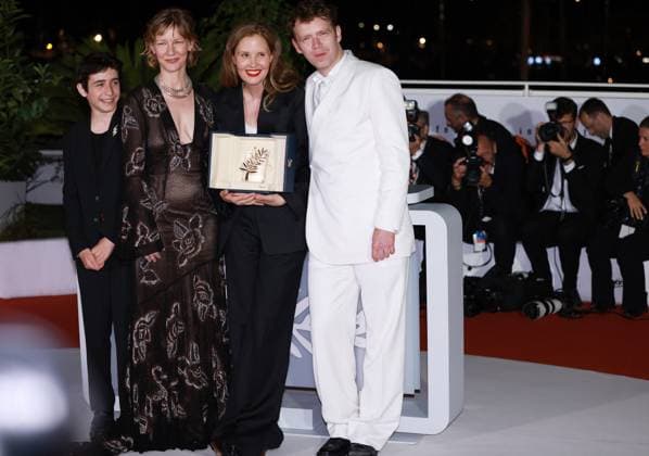 (230528) -- CANNES, May 28, 2023 -- French director Justine Triet (2nd R) poses with the trophy with cast members during a photocall after she won the Palme d Or for the film Anatomie d une Chute (Anatomy of a Fall) during the closing ceremony of the 76th edition of the Cannes Film Festival in Cannes, southern France on May 27, 2023. French director Justine Triet was awarded with the Palme d Or at the 76th Cannes Film Festival for her Anatomy of a Fall on Saturday in Cannes, France, becoming the third female director winning this top prize. ) FRANCE-CANNES-FILM FESTIVAL-PALME D OR GaoxJing 