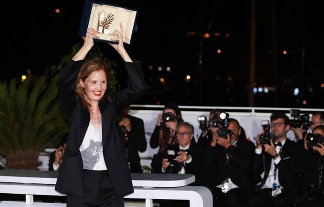 (230528) -- CANNES, May 28, 2023 -- French director Justine Triet poses with the trophy during a photocall after she won the Palme d Or for the film Anatomie d une Chute (Anatomy of a Fall) during the closing ceremony of the 76th edition of the Cannes Film Festival in Cannes, southern France on May 27, 2023. French director Justine Triet was awarded with the Palme d Or at the 76th Cannes Film Festival for her Anatomy of a Fall on Saturday in Cannes, France, becoming the third female director winning this top prize. ) FRANCE-CANNES-FILM FESTIVAL-PALME D OR GaoxJing 