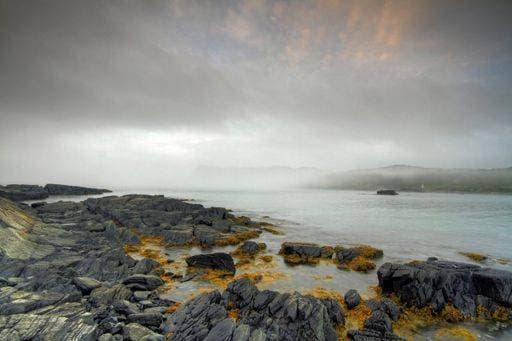 A beautiful shot of a misty sunrise sky over the shore of Brigus South, Canada *** einer Schönes erschossen des einer nebelbedeckte Sonnenaufgang Himmel trueber der Ufer des Brigus South, Kanada 8359221 RECORD DATE NOT STATED