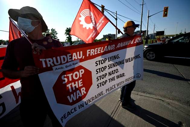 May 31, 2023, Ottawa, ON, CAN: Anti-war protesters rally at an entrance to the CANSEC trade show, billed as North AmericaöÄÃ s largest multi-service defence event, in Ottawa, on Wednesday, May 31, 2023. Ottawa CAN  - ZUMAc35_ 20230531_zaf_c35_009 Copyright: xJustinxTangx
