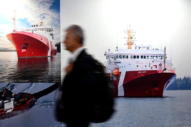 May 31, 2023, Ottawa, ON, CAN: An attendee passes pictures of the Coast Guard offshore fisheries science vessel John Cabot at the Seaspan booth at the CANSEC trade show, billed as North AmericaöÄÃ s largest multi-service defence event, in Ottawa, on Wednesday, May 31, 2023. Ottawa CAN  - ZUMAc35_ 20230531_zaf_c35_034 Copyright: xJustinxTangx