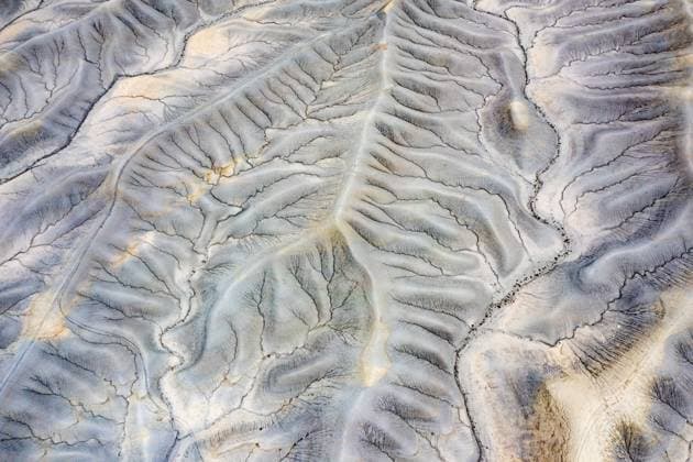 Creative Highlights World Abstract aerial view of the Mancos Shale formation of the Upper Blue Hills badlands around Factory Butte near Caineville, Utah. Hanksville Caineville Desert Utah United States Copyright: xJonxG.xFullerx xVWPicsx 0103-JGF-aerial landscapes-Factory Butte Badlands-US-UT
