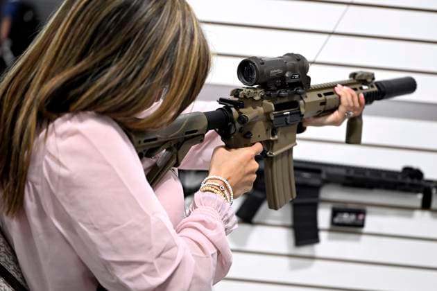 May 31, 2023, Ottawa, ON, CAN: An attendee holds a Colt C8A4 rifle at the CANSEC trade show, billed as North AmericaöÄÃ s largest multi-service defence event, in Ottawa, on Wednesday, May 31, 2023. Ottawa CAN  - ZUMAc35_ 20230531_zaf_c35_038 Copyright: xJustinxTangx